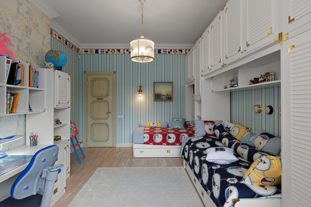 Design ideas for a mid-sized traditional kids' bedroom for boys in Other with blue walls and light hardwood floors.