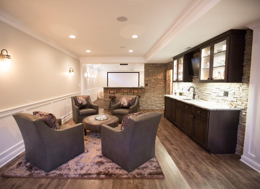 This is an example of a large transitional open concept family room in Chicago with vinyl floors, a game room, beige walls, no fireplace, a built-in media wall and brown floor.
