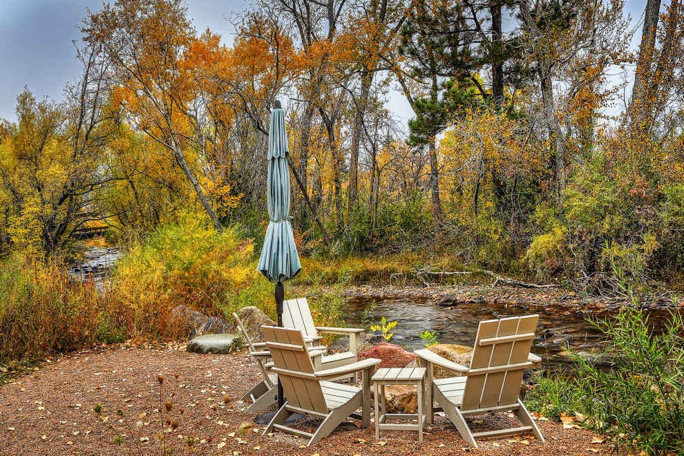 Example of a mountain style patio design in Denver
