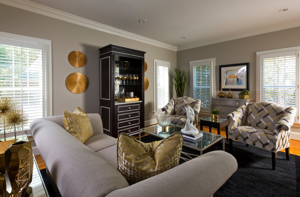 Transitional formal enclosed living room in Charlotte with grey walls, medium hardwood floors and orange floor.