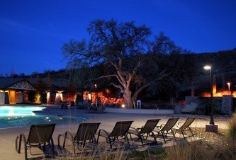 Example of a large transitional backyard concrete and custom-shaped pool design in San Francisco