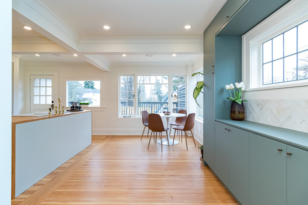 Inspiration for a large transitional medium tone wood floor, brown floor and coffered ceiling kitchen/dining room combo remodel with white walls