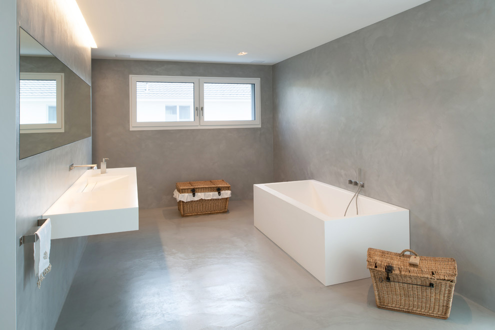 Design ideas for a modern bathroom in Other with white cabinets, an integrated sink and solid surface benchtops.