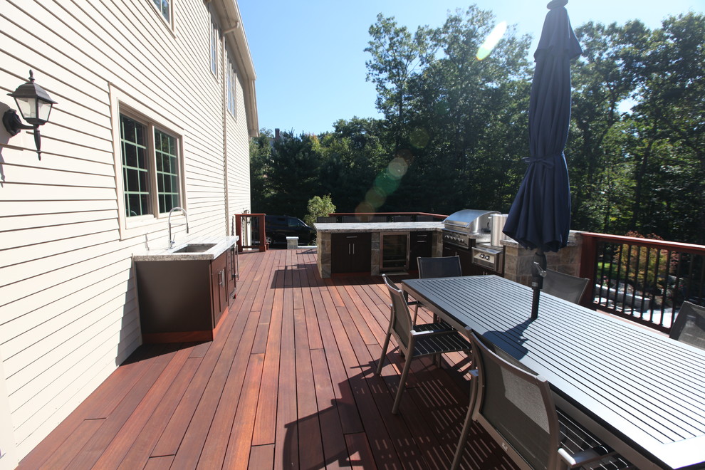 Large transitional backyard patio in Bridgeport with an outdoor kitchen, decking and no cover.