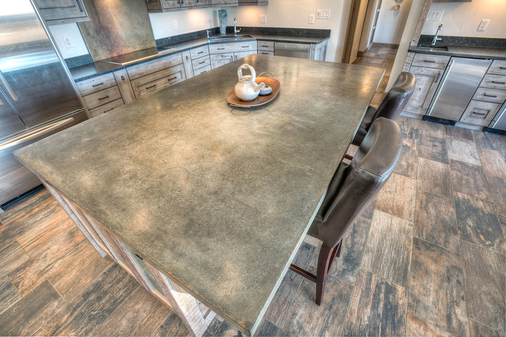Mountain style l-shaped ceramic tile eat-in kitchen photo in Denver with a double-bowl sink, beaded inset cabinets, gray cabinets, granite countertops, gray backsplash, stainless steel appliances and an island