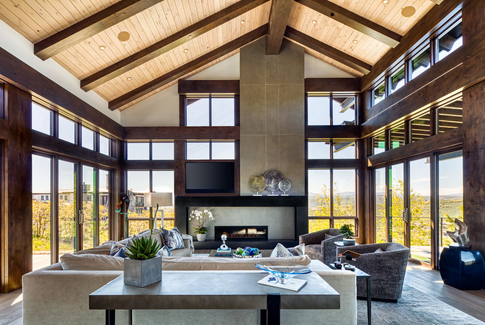 Example of a mid-sized mountain style open concept dark wood floor and brown floor living room design in Salt Lake City with white walls and a ribbon fireplace