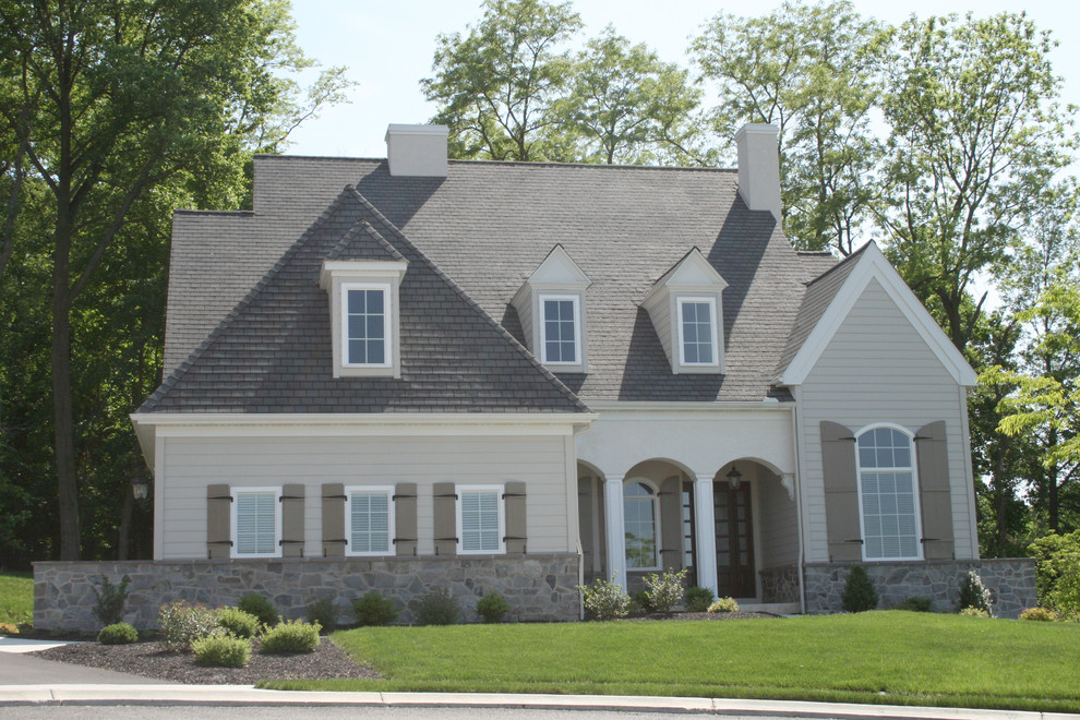 Mid-sized transitional gray two-story mixed siding house exterior idea with a hip roof and a shingle roof