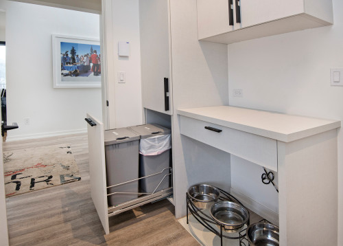 A rarely used desk was repurposed into a practical feeding station by placing raised dog bowls neatly underneath.