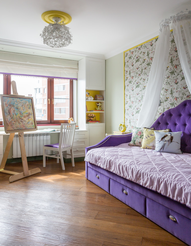 Design ideas for an eclectic kids' bedroom for girls in Toronto with multi-coloured walls, medium hardwood floors and brown floor.