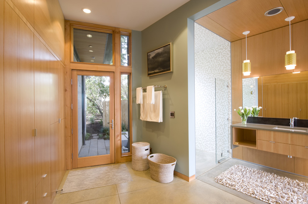 This is an example of a contemporary bathroom in Seattle with an undermount sink, flat-panel cabinets, medium wood cabinets, an alcove shower, white tile and mosaic tile.