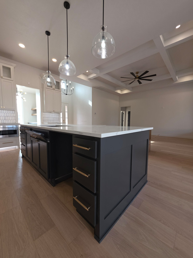 Quartz Countertops, hardwood floors, and seated kitchen island