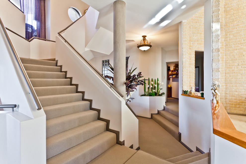 Contemporary carpeted staircase in Perth with carpet risers.