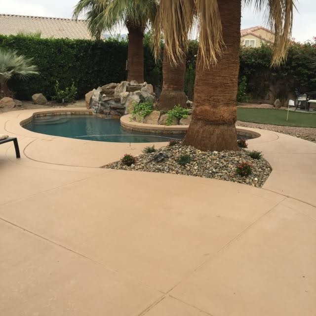 Inspiration for a mid-sized backyard concrete paver pool fountain remodel