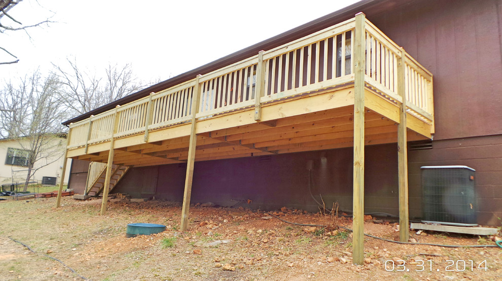 Inspiration for a mid-sized backyard deck remodel with decking and no cover