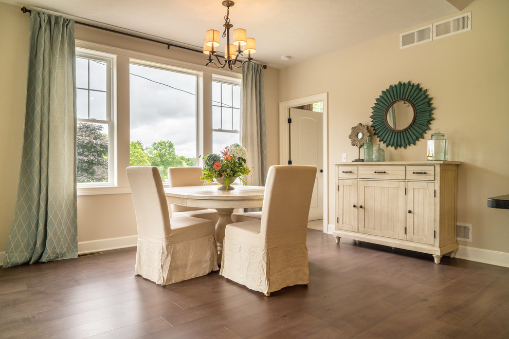 Design ideas for a mid-sized beach style open plan dining with dark hardwood floors, brown floor and beige walls.