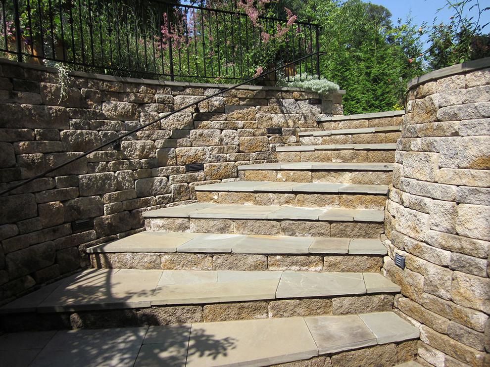 This is an example of a traditional backyard garden in Baltimore with a retaining wall.