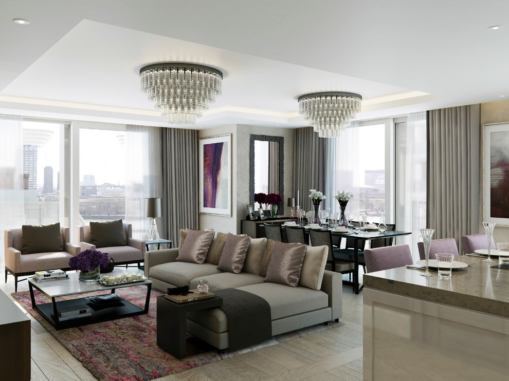 Photo of a contemporary formal open concept living room in London with beige walls and light hardwood floors.