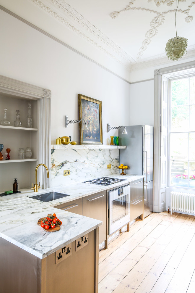 Photo of a mid-sized transitional l-shaped eat-in kitchen in Other with flat-panel cabinets, stainless steel cabinets, marble benchtops, no island, an undermount sink, multi-coloured splashback, marble splashback, stainless steel appliances, light hardwood floors and yellow floor.