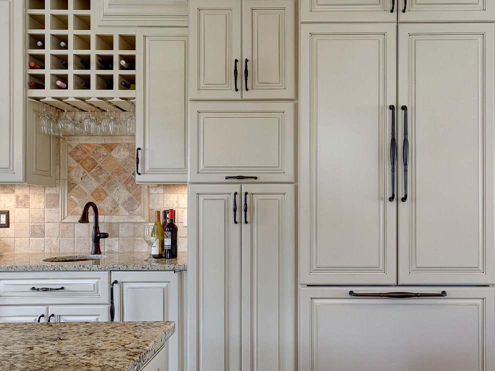 Eat-in kitchen - rustic eat-in kitchen idea in Columbus with a farmhouse sink, flat-panel cabinets, white cabinets, marble countertops, beige backsplash, stone tile backsplash and stainless steel appliances