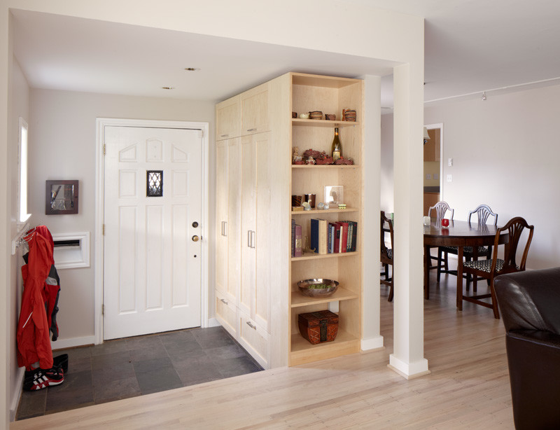 Foyer - mid-sized transitional slate floor foyer idea in Seattle with gray walls and a white front door