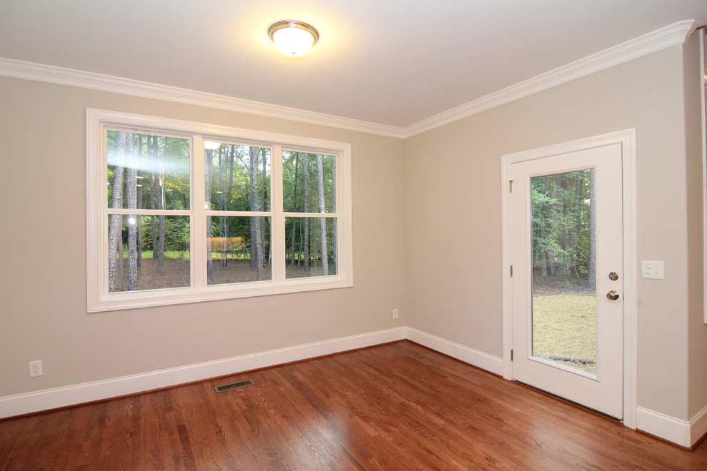 Mid-sized transitional kitchen/dining combo in Raleigh with grey walls and light hardwood floors.