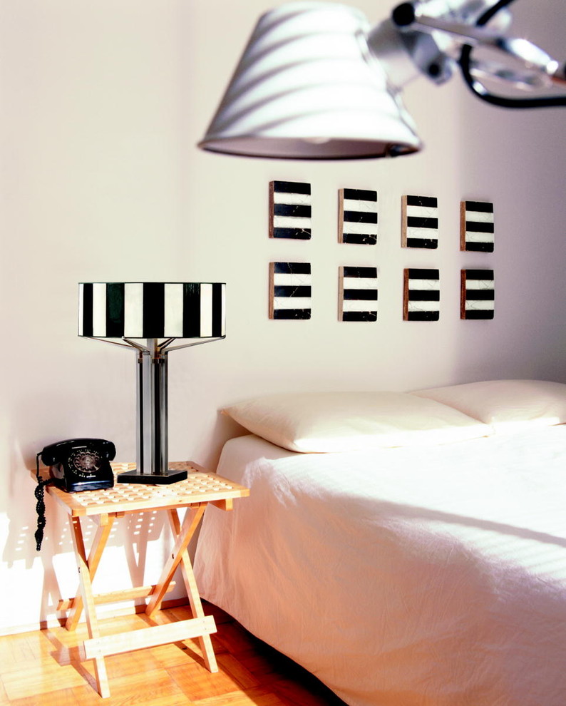 Inspiration for an eclectic bedroom in New York with white walls.