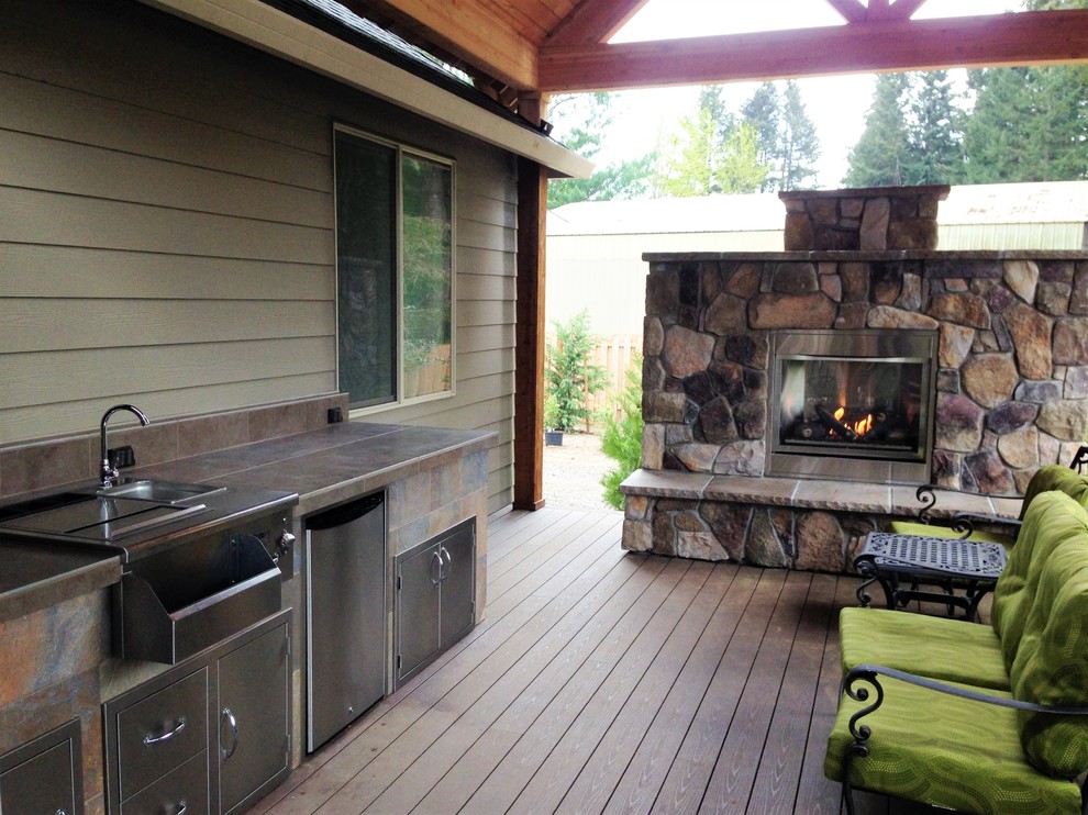 Inspiration for a contemporary backyard deck in Portland with an outdoor kitchen.