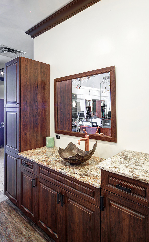 Inspiration for a mid-sized rustic master brown tile and ceramic tile ceramic tile bathroom remodel in Ottawa with a vessel sink, raised-panel cabinets, brown cabinets, granite countertops, a two-piece toilet and beige walls