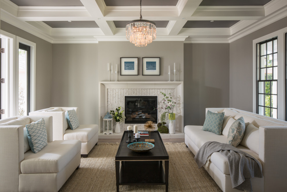 Living room - mid-sized transitional open concept beige floor and coffered ceiling living room idea in Los Angeles with gray walls, a standard fireplace and a stone fireplace