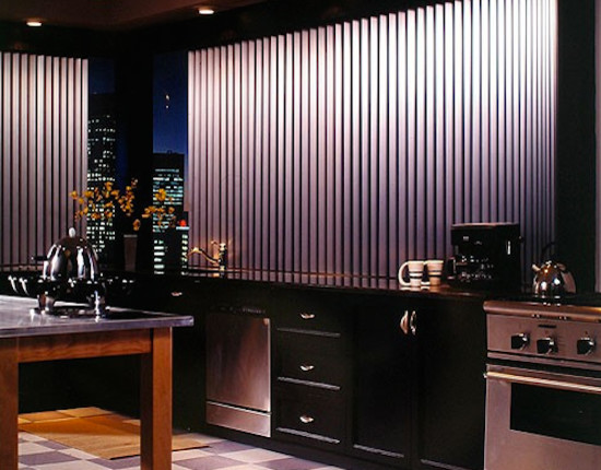 Inspiration for a mid-sized ceramic tile eat-in kitchen remodel with a drop-in sink, black cabinets, black backsplash, stainless steel appliances and an island