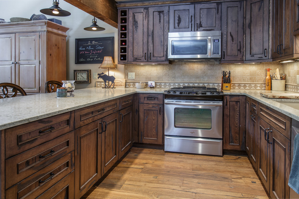 Inspiration for a rustic kitchen remodel in Denver with furniture-like cabinets and distressed cabinets