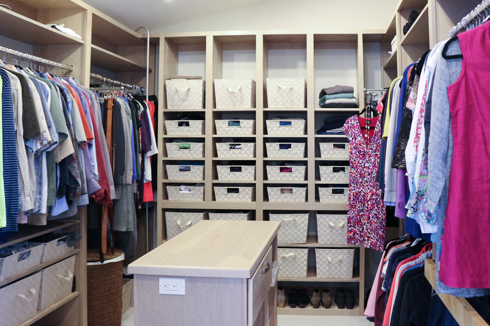 Photo of a mid-sized transitional gender-neutral walk-in wardrobe in Seattle with flat-panel cabinets, grey cabinets, ceramic floors, beige floor and vaulted.