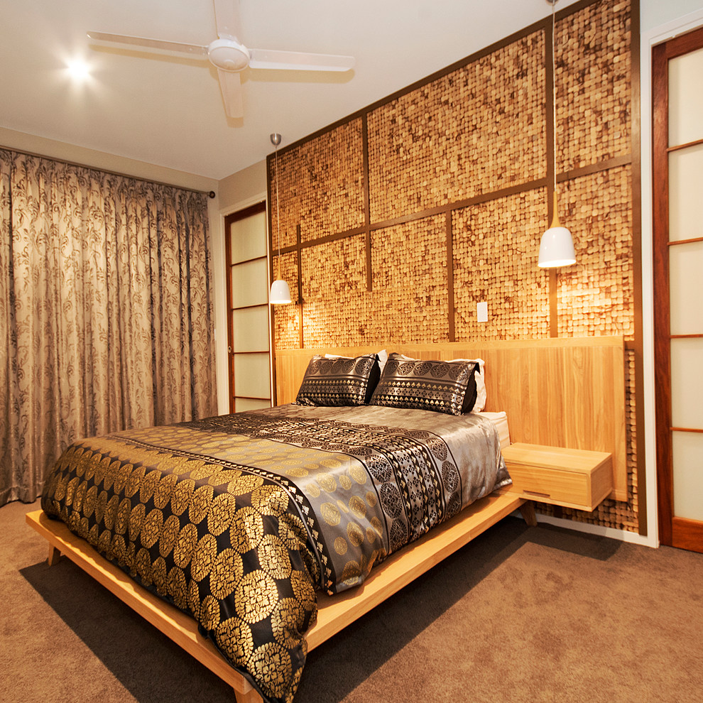 Inspiration for a large asian master bedroom in Sunshine Coast with green walls, carpet, no fireplace and grey floor.