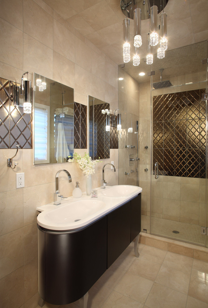 Contemporary bathroom in New York with an integrated sink, dark wood cabinets, an alcove shower, beige tile and flat-panel cabinets.