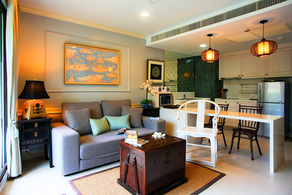 This is an example of an asian open concept living room in Other with blue walls.