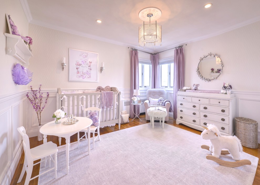 Mid-sized transitional girl carpeted nursery photo in New York with white walls