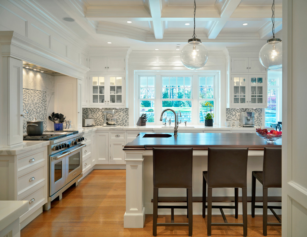 Design ideas for a traditional kitchen in Boston with mosaic tile splashback and marble benchtops.