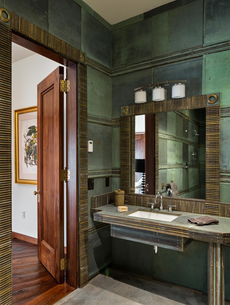 Mid-sized contemporary master bathroom in New York with an open shower, green tile, green walls, concrete floors, an undermount sink, grey floor, an open shower, a one-piece toilet, metal tile and copper benchtops.