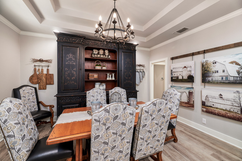 Example of a mid-sized transitional u-shaped vinyl floor and brown floor kitchen pantry design in Austin with a farmhouse sink, shaker cabinets, white cabinets, quartz countertops, white backsplash, marble backsplash, black appliances, two islands and white countertops