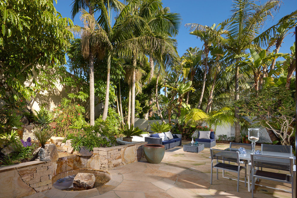 Photo of a tropical home design in Orange County.