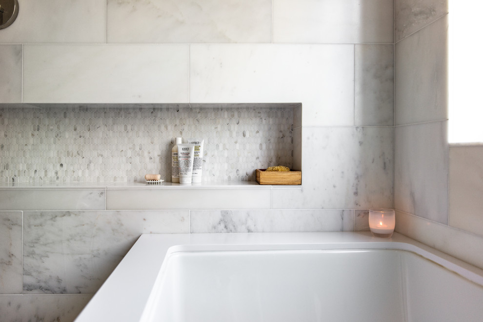 Inspiration for a medium sized modern ensuite bathroom in San Francisco with freestanding cabinets, medium wood cabinets, a submerged bath, a walk-in shower, a one-piece toilet, white tiles, stone tiles, white walls, marble flooring, an integrated sink, engineered stone worktops, white floors, an open shower and white worktops.