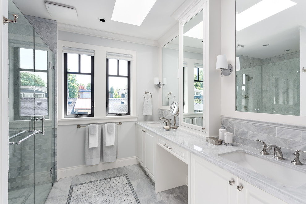 This is an example of a mid-sized traditional master bathroom in Vancouver with raised-panel cabinets, white cabinets, an open shower, multi-coloured tile, ceramic tile, white walls, an undermount sink, quartzite benchtops, grey floor and a hinged shower door.