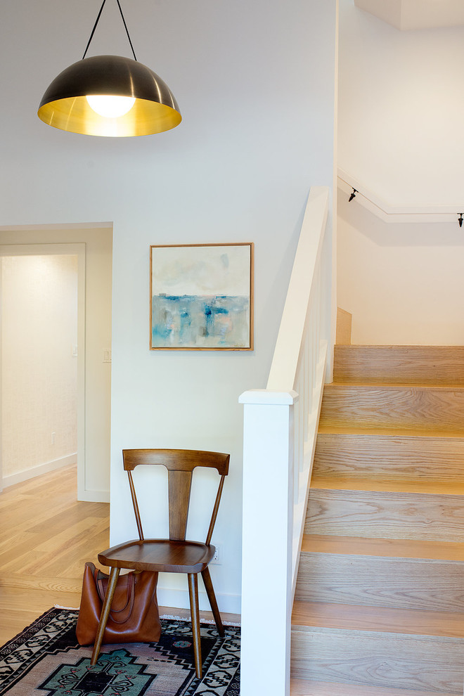 Mid-sized transitional wood l-shaped staircase in San Francisco with wood risers and wood railing.