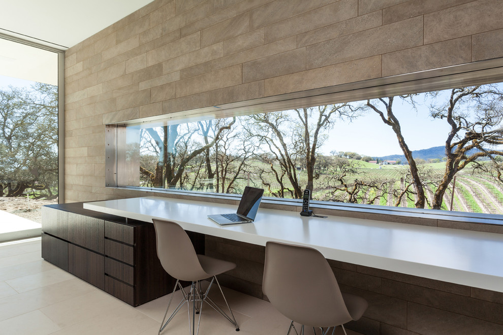 This is an example of a modern home office in Houston with grey walls.