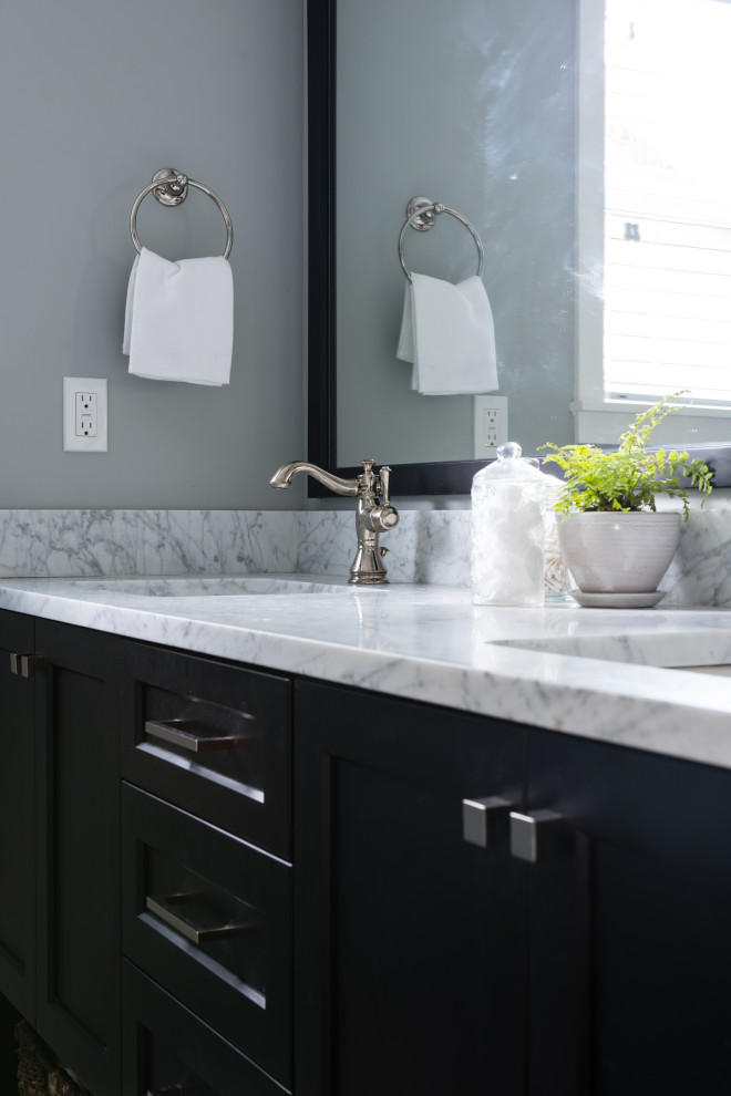 Inspiration for a small transitional master white tile and porcelain tile porcelain tile, beige floor and double-sink doorless shower remodel in Seattle with shaker cabinets, black cabinets, a one-piece toilet, gray walls, marble countertops, white countertops, a niche and a built-in vanity