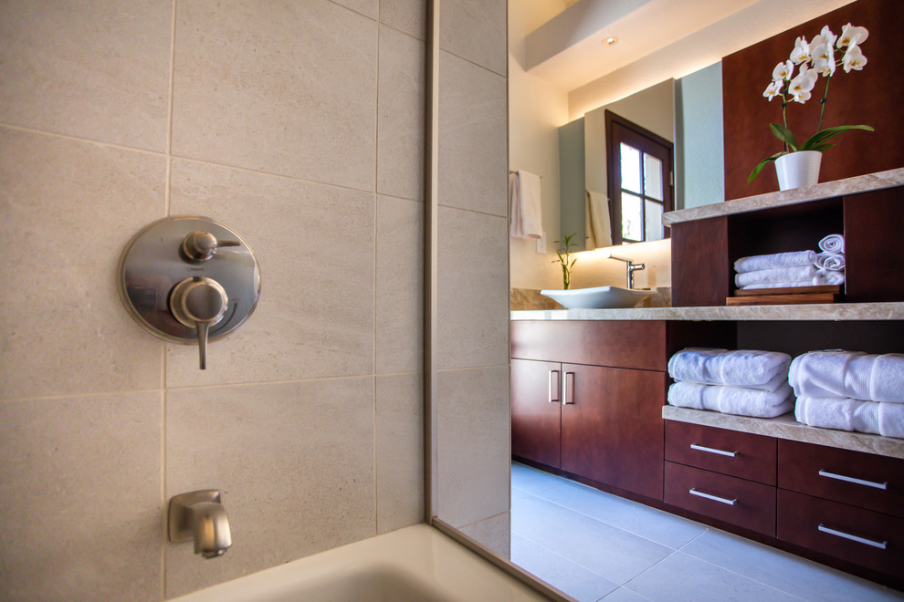 Alcove bathtub - small transitional beige tile and porcelain tile porcelain tile and beige floor alcove bathtub idea in Phoenix with flat-panel cabinets, medium tone wood cabinets, a one-piece toilet, beige walls, a vessel sink and granite countertops