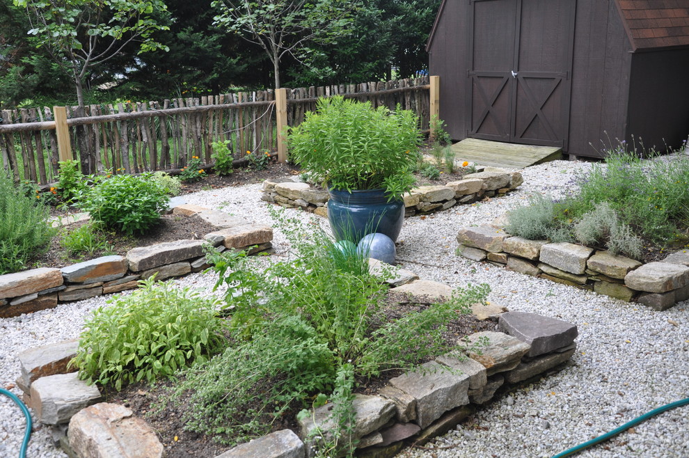 Inspiration for a mid-sized eclectic backyard full sun garden for summer in Baltimore with gravel.