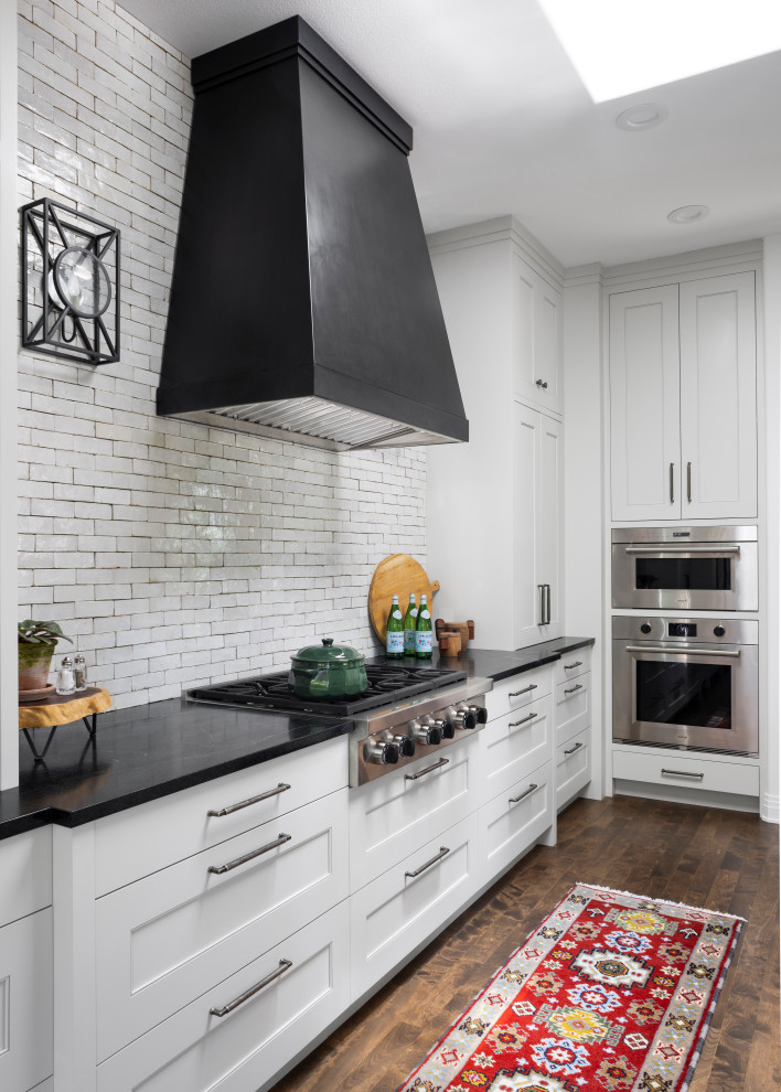 Example of a transitional kitchen design in Denver