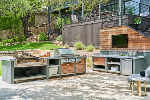 Modular outdoor kitchen using RTA cabinets with grill, sink, and prep zones