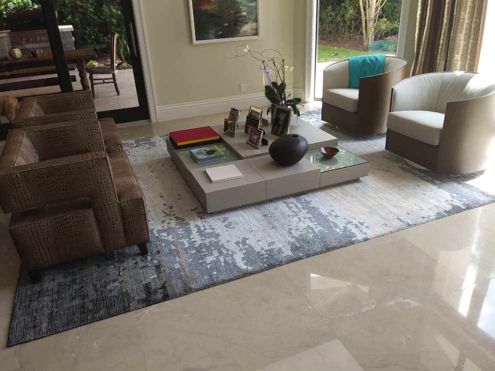 Mid-sized modern formal open concept living room in Miami with beige walls, marble floors, no fireplace, no tv and beige floor.